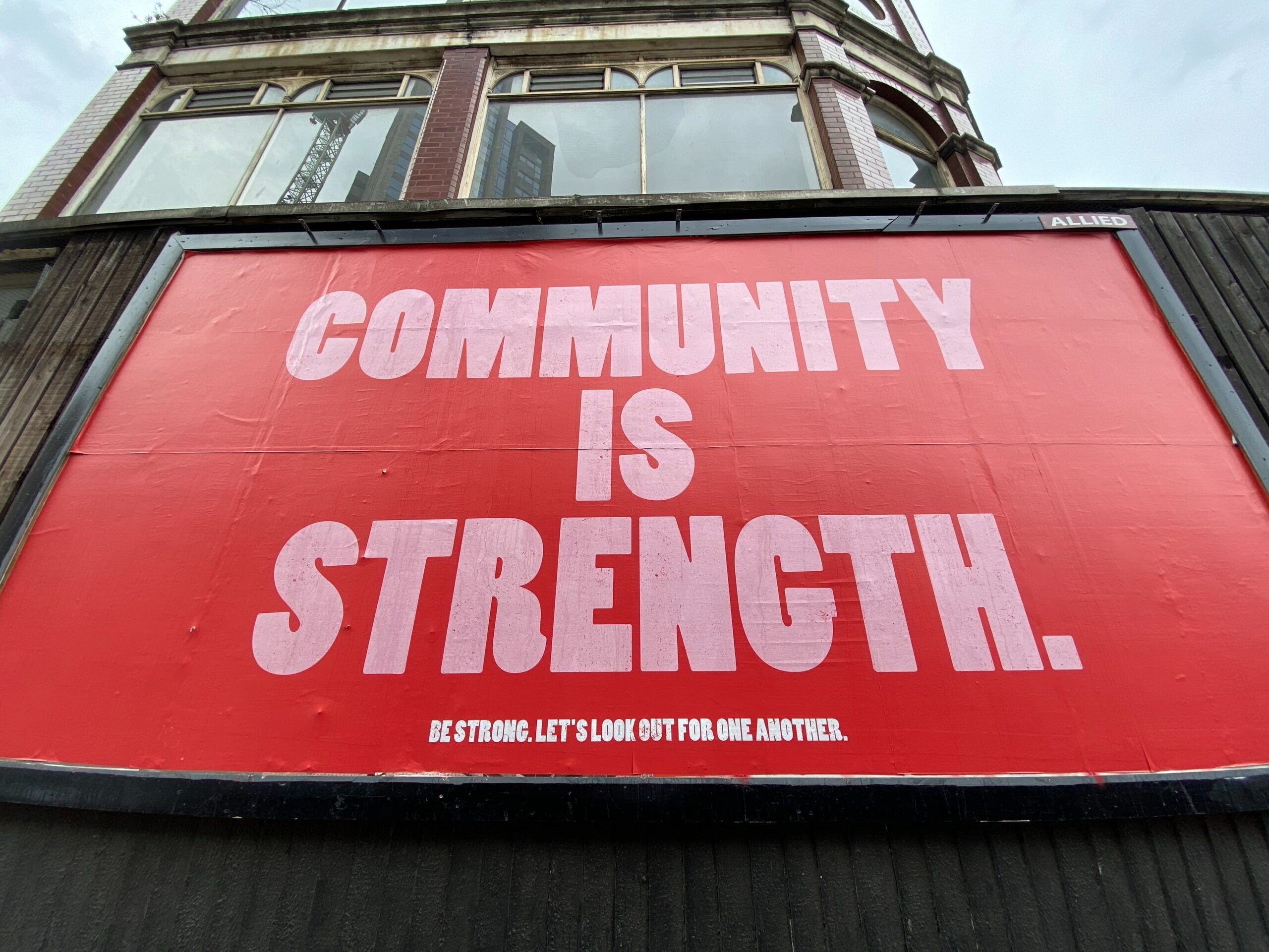 Billboard that says Community is Strength